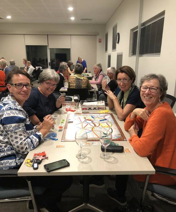 Gaming fun: Participants enjoying the Neighbourhood Centre Week Games Night on May 10. Photo: Supplied. 