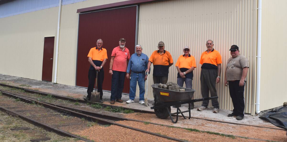 Men at work: Men's Shed members gathere outside the new facility ahead of its official opening back in 2015. Photo: Supplied.