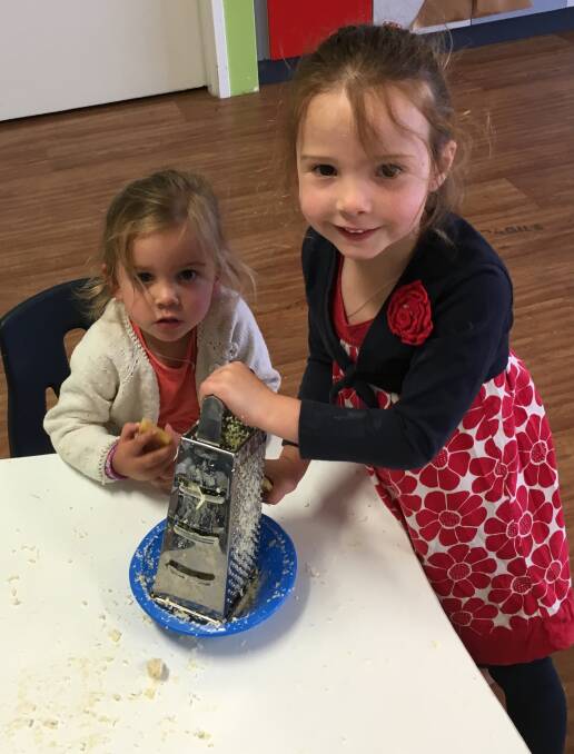 Having fun: Pia and Skye Hulse make beeswax wrap at Darkan Kids Central last week after receiving a grant from Nude Foods.