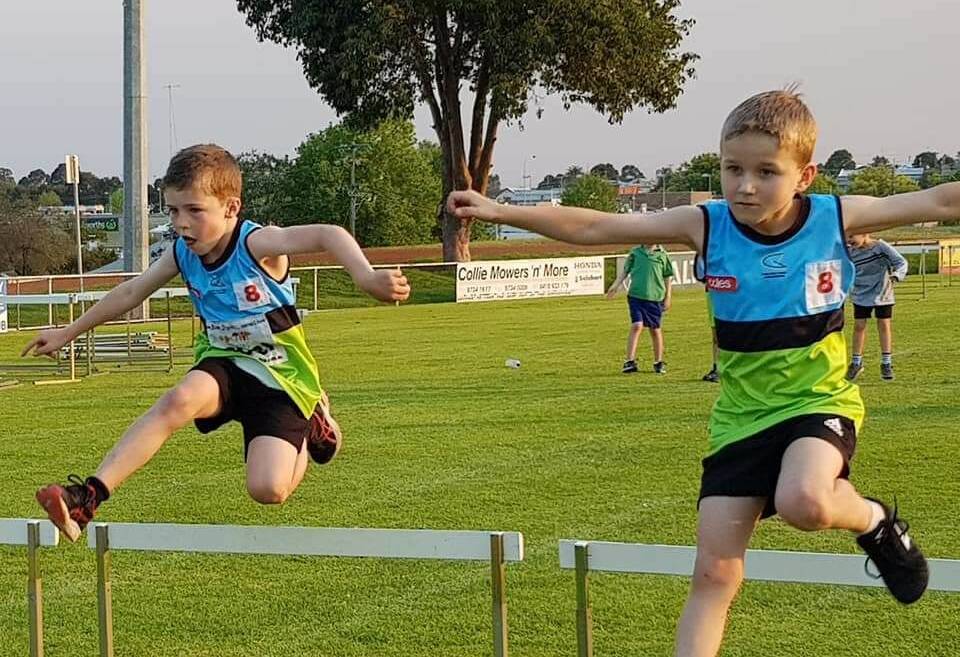 Up and over: Blake Digney jumps a hurdle during a recent under 8 race at Collie Little Athletics. Photo: Amanda Carter.