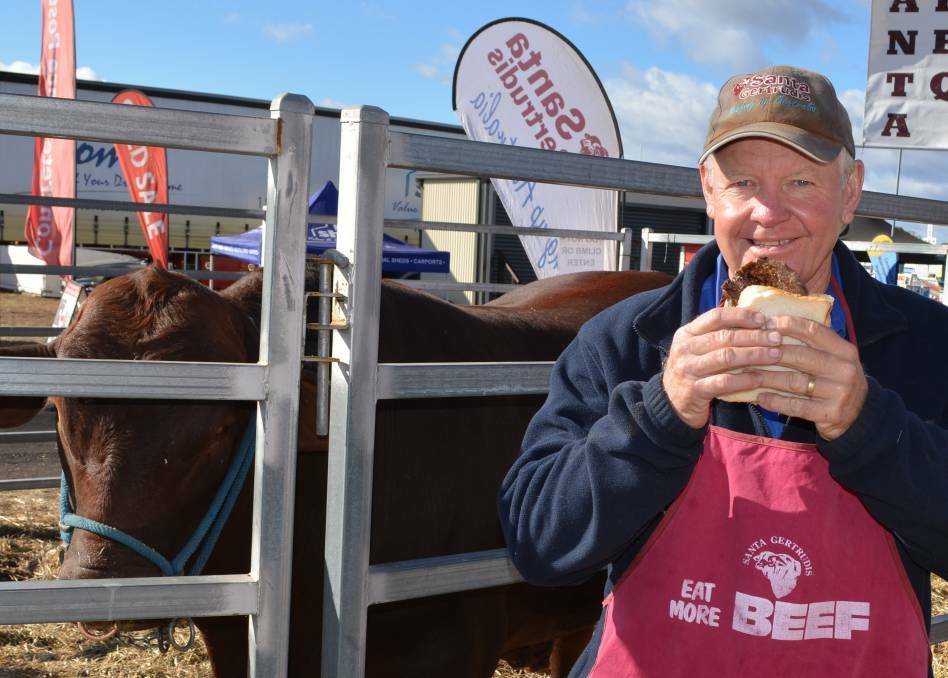 FOOD FOR THOIGHT: Santa Gertrudis Breeders' Association general manager Chris Todd samples a real piece of beef at the AgQuip field days in Gunnedah, NSW.