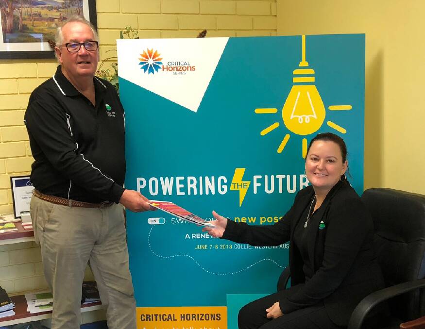 Outgoing Collie Chamber of Commerce and Industry chief executive Richard Jackson hands over the reins to Bec Woods. Photo: supplied