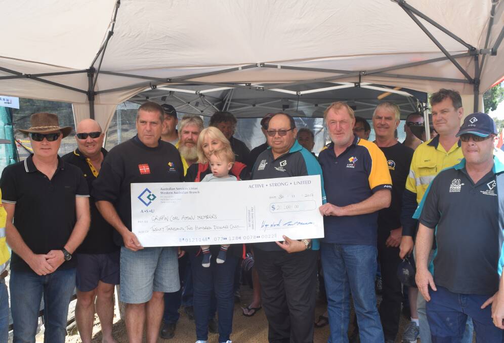 Australian Services Union WA branch secretary Wayne Wood presenting a cheque to the maintenance workers at Griffin Coal. Photo by Ashley Bolt.