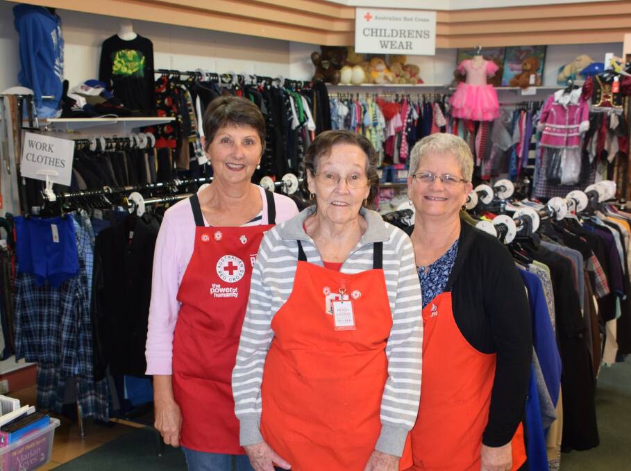 Red Cross volunteer Betty Martin with Leonie Smith and Pam Head. Ms Martin was recognised for her 20 years of service to the Red Cross Collie store at a morning tea on Wednesday. Photo: Ashley Bolt