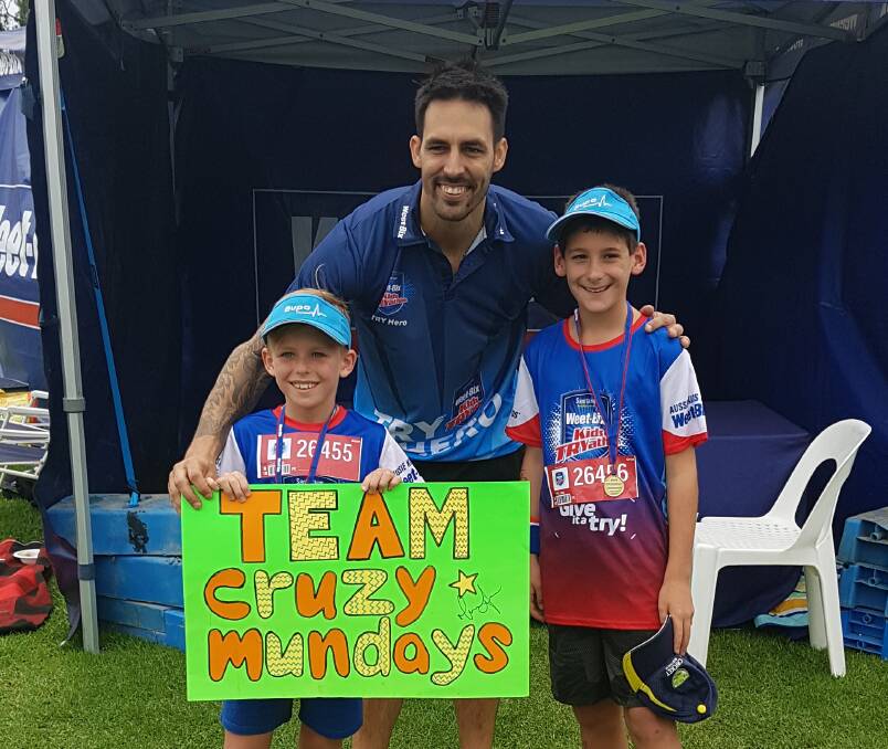 Jesse Munday and Cruz McCagh with Mitchell Johnson after placing second in the Weet-bix Kids TRYathlon under 10 team race. Photo: supplied