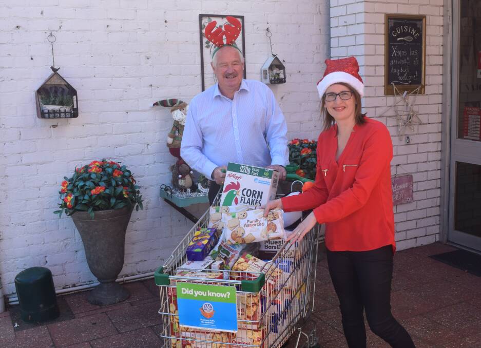 Collie-Preston MLA Mick Murray and shire president Sarah Stanley with some of the donations already received.
