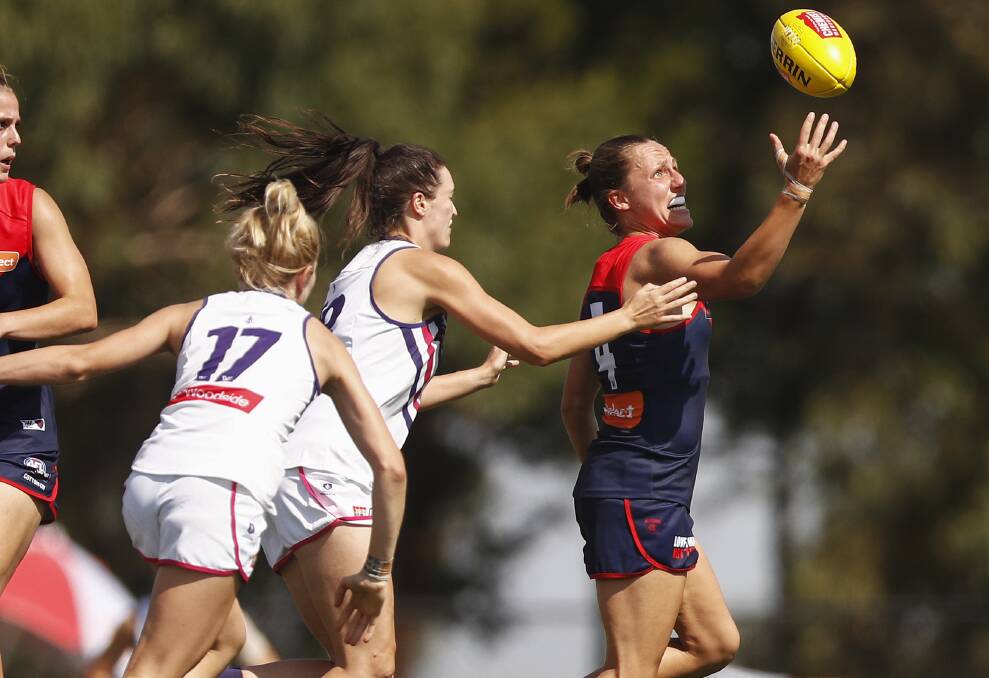 Philipa Seth prepares to tackle Melbourne star Karen Paxman in her AFLW debut at Casey Fields on Sunday. Photo: Daniel Pockett/AAP