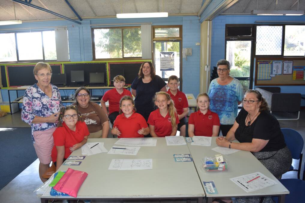 Students and tutors at The Smith Family's Amaroo Primary School learning club, which is looking for more volunteer tutors. Photo by Ashley Bolt.