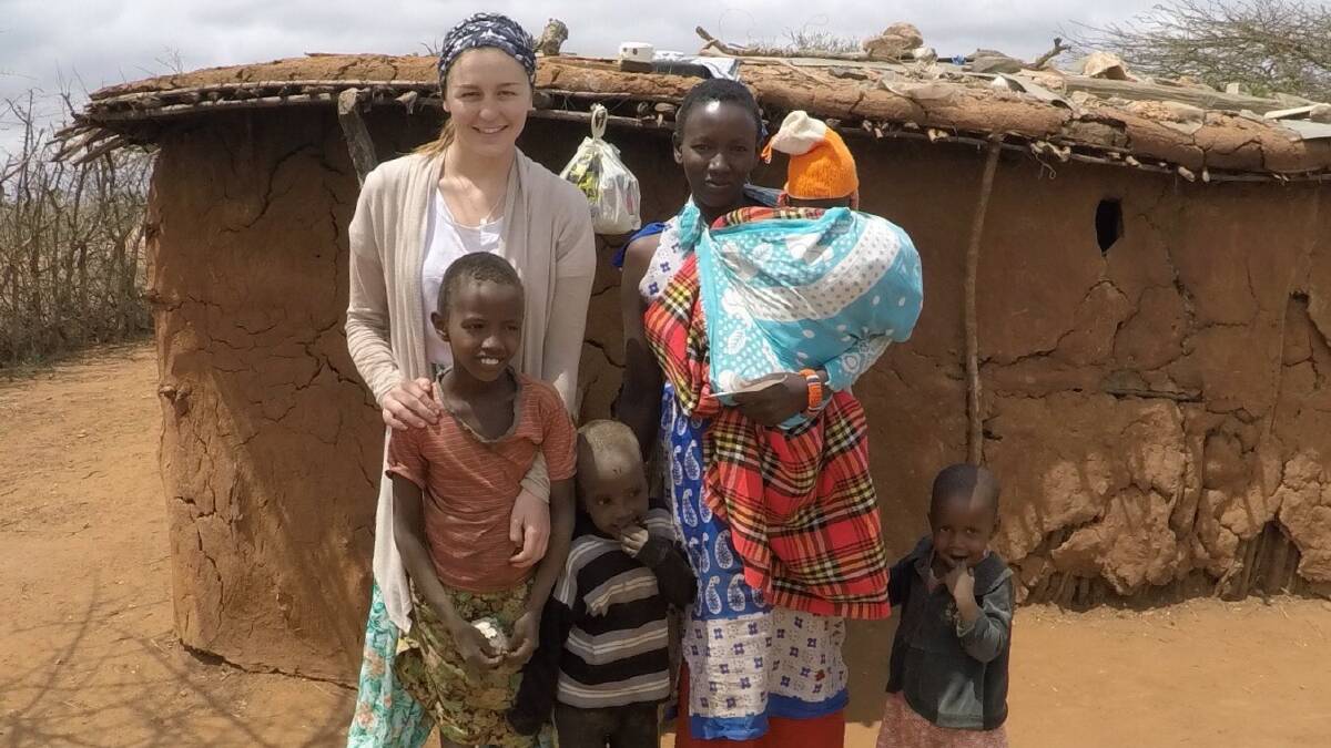 Lending a helping hand: Lauren Jackson in the village where she spent most of her time volunteering during her time in Africa. Photo: Supplied. 