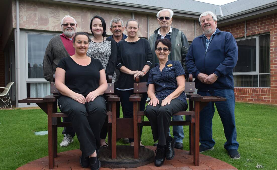 Hand made donation: Members of the Collie Menshed presented staff from the ValleyView Residence with the hand made chair, which will be places out the front of the facility. Photo: Shannon Wood. 
