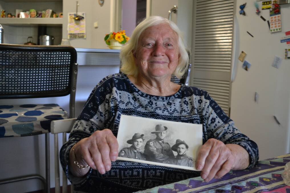 REMEMBERING: Glenis Vernon holding a photo of her father Gordon and uncles Albert and Henry from WWI. Photo: Breeanna Tirant. 