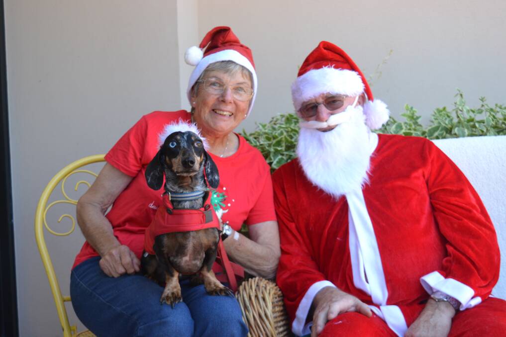Tim Elliot and Jock with Santa Claus at the Collie Public Library. Photo: Breeanna Tirant 