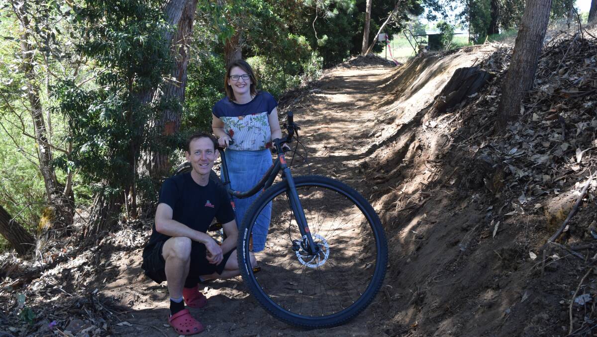 Crank'n Cycles owner Erik Mellegers with Shire of Collie president Sarah Stanley at the Trail Head of the Collie Wagyl Biddi trail network. Photo by Jemillah Dawson.