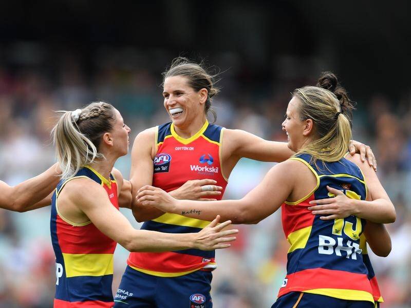 Adelaide will meet Carlton in the AFLW grand final after thrashing Geelong in the preliminary final.