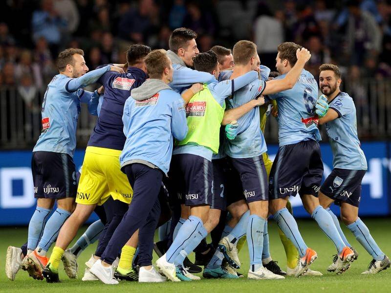 Sydney FC celebrate winning their fourth A-League title on penalties over Perth Glory.