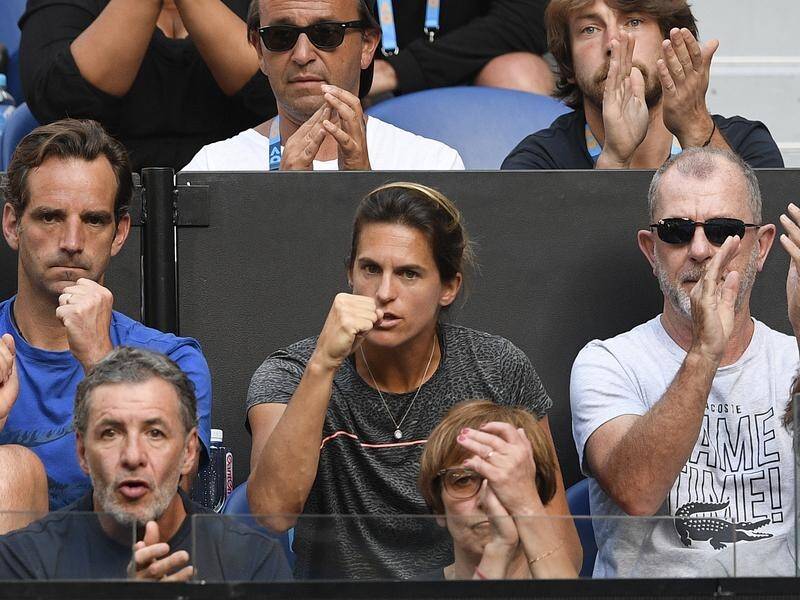 Lucas Pouille has hailed Amelie Mauresmo, centre, after his win over Milos Raonic.