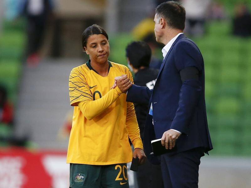Sam Kerr shakes coach Ante Milicic's hands during the Matildas' clash against Argentina.