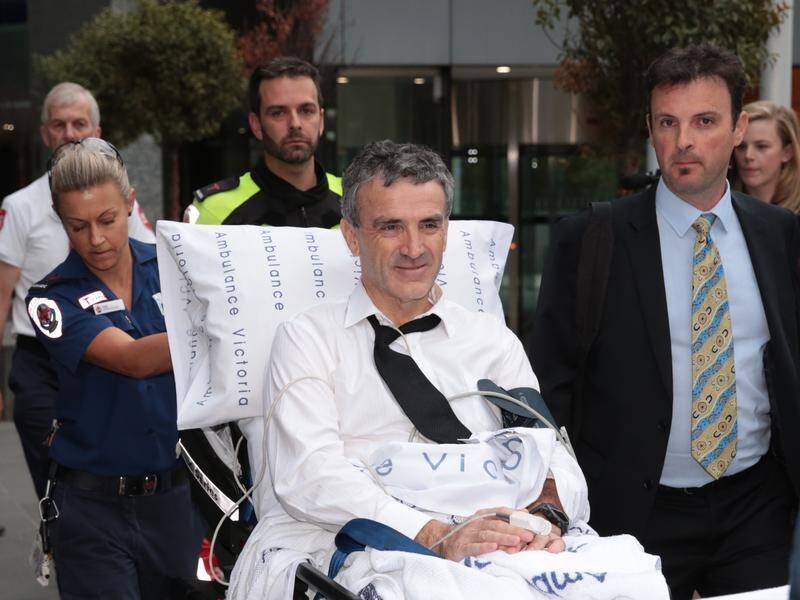 Terry McMaster (centre) collapsed in the witness box at the banking royal commission .