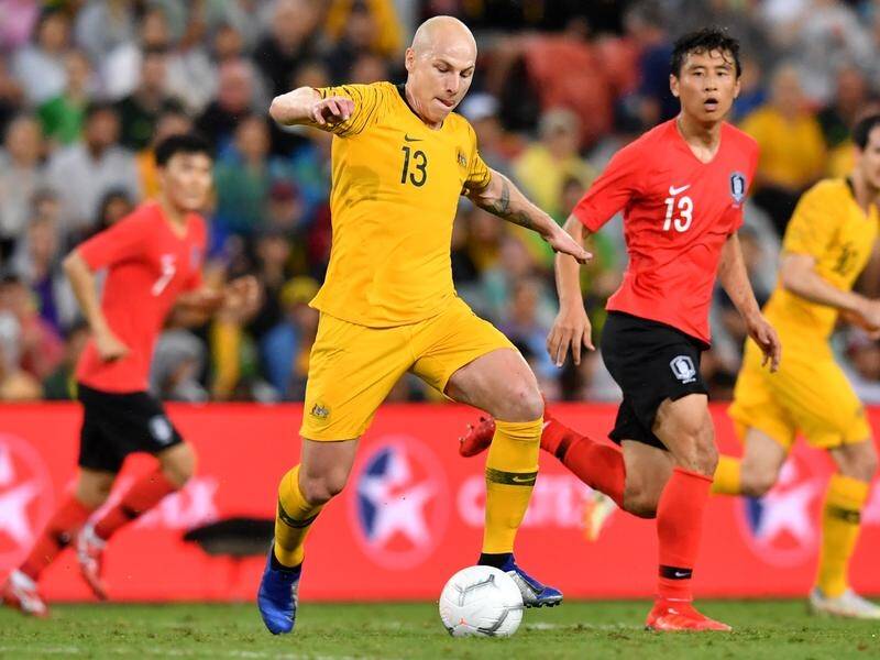 Playmaker Aaron Mooy (C) will miss the Socceroos' defence of the Asian Cup next year.