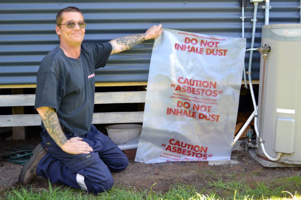 Warning: Thomas Cleary with the asbestos caution sheet that was placed on his home.