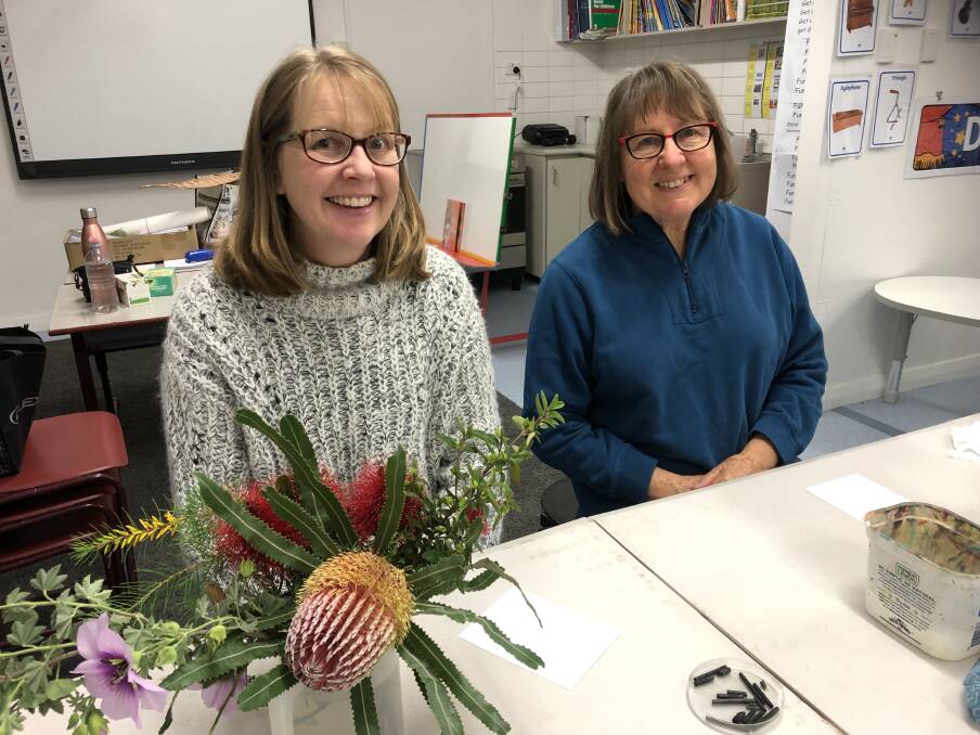 Blooming talent: Kerryn Chia and Pam Wales enjoying the recent Wildflower Workshop by artist and biodiversity educator Angela Rossen. Photo: Supplied.