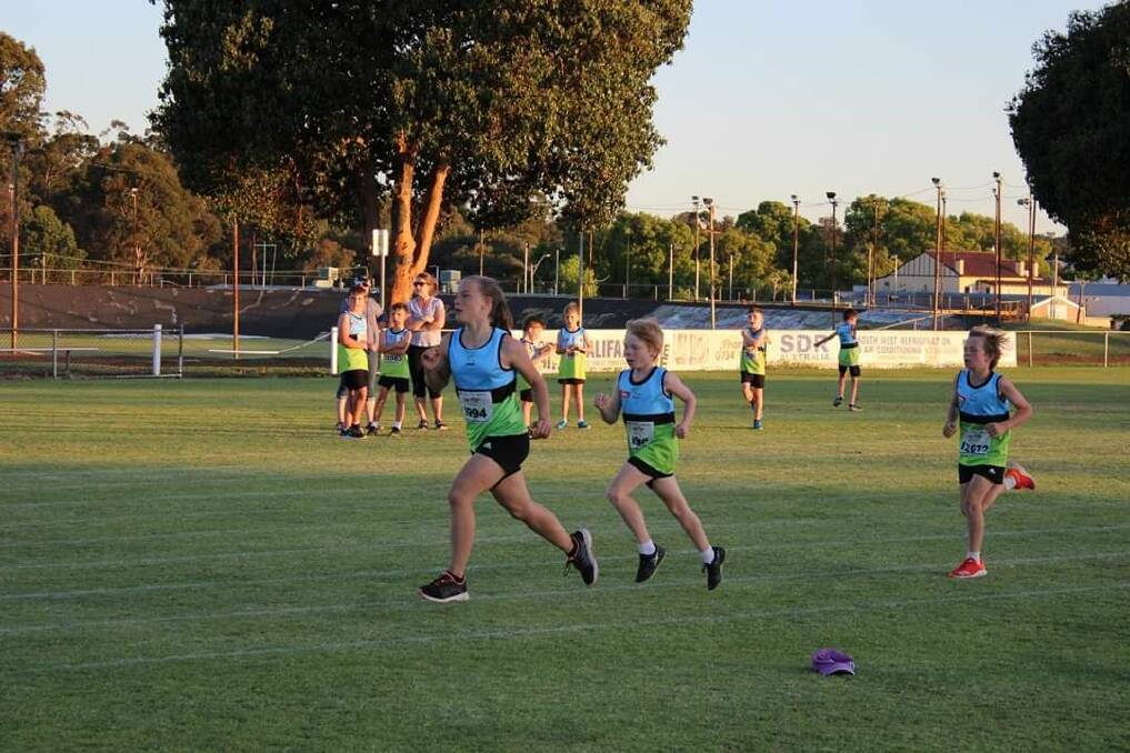 Endurance: Under 11s and Under 12s running the 1500m event. Photo: Supplied.