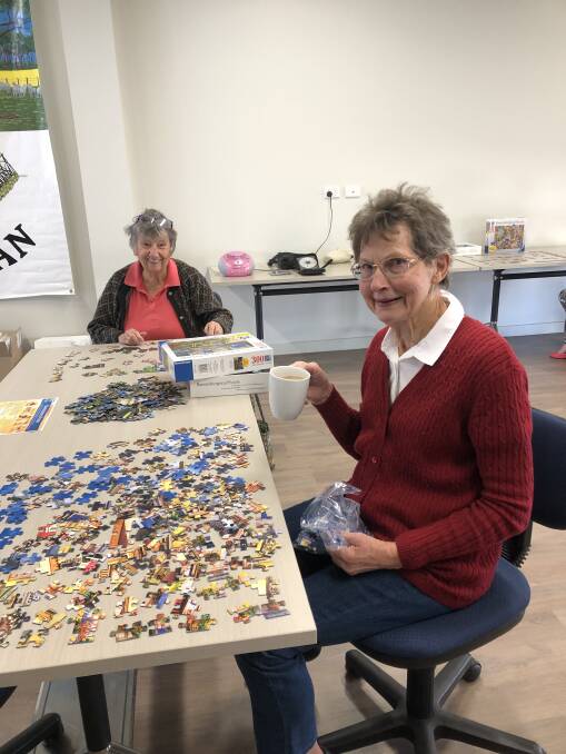 Anne Hart (back) and Lyn White enjoying the jigsaw puzzle session at the West Arthur CRC. Photo: Supplied. 