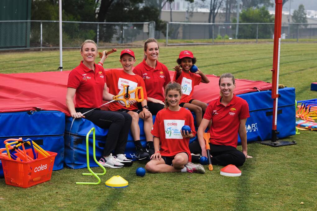 Donation: World Champions Sally Pearson and Kelsey-Lee Barber with Little Athletes and new equipment. Photo: Supplied.