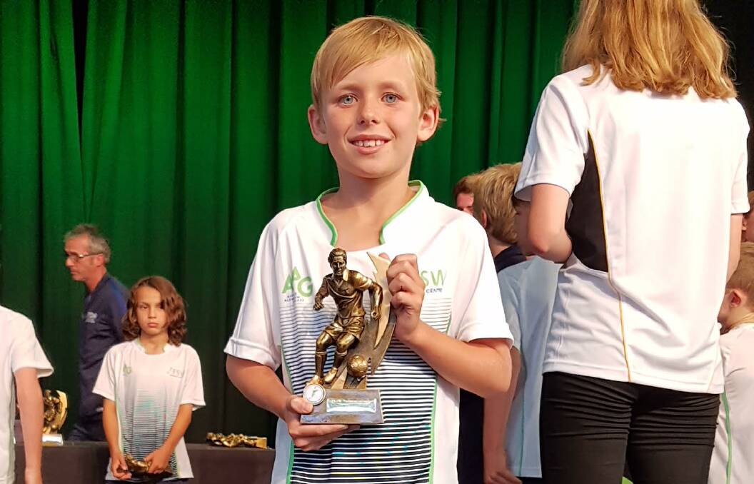 Achievement: Jesse Munday with his trophy at the Football Federation South West awards in Busselton. Photo: supplied.