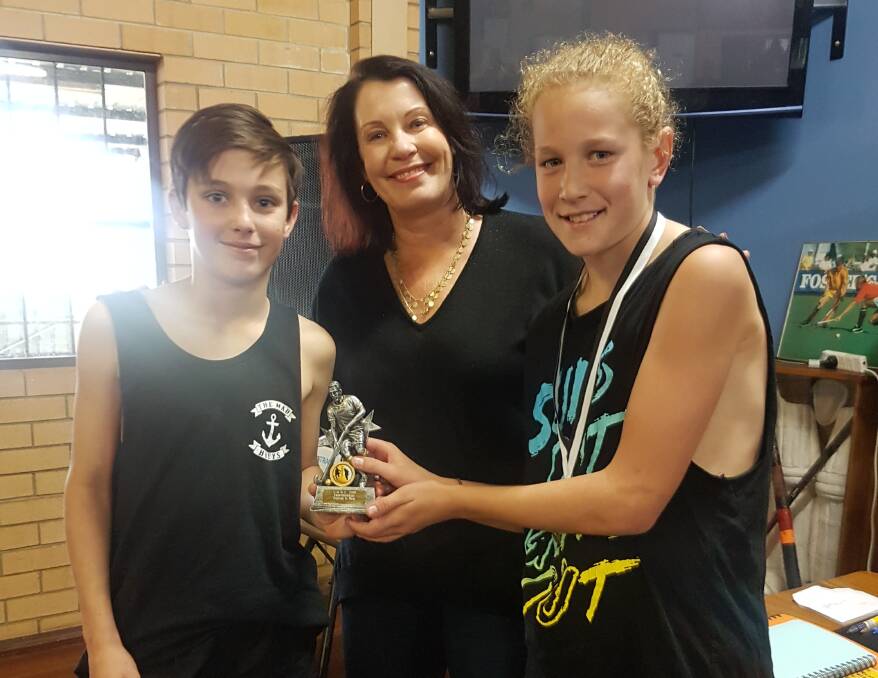 Good sportsmanship: Primary A joint fairest and best Hayden Fogarty and Tom Bell with Amanda Smith (centre). Photo: supplied.