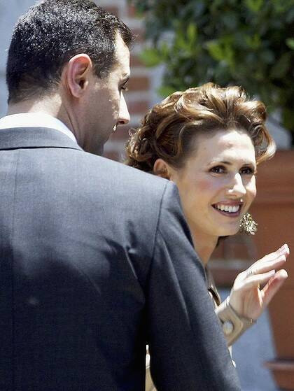 Louboutin-loving... London-raised Asma al-Assad, pictured with husband and Syrian leader Bashar, has been called 'the eastern Diana'.