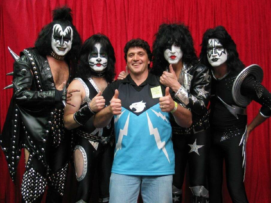 Rocking on: Sal Mileto was photographed with Kiss band members after attending one of their Alive/35 World Tour performances in 2001. The photo has been framed and hangs proudly in the Mileto family lounge room.