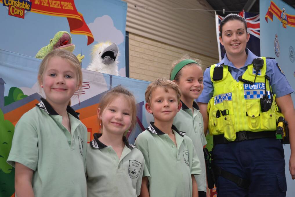 Community safety: Allanson Primary School students Zoe Hawks, Bradley Glenn, Kaydence Fleay and Sophie Stanley learn an important message from Constable Lucy Danaher during a visit by Constable Care.